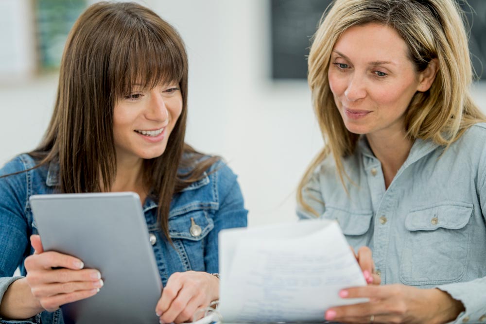 altura-two-women-ipads-chat care training